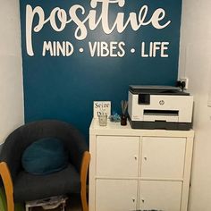 there is a blue wall with the words positive mind vibes life written on it