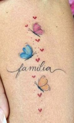 a woman's stomach with butterflies and the word familla written on it