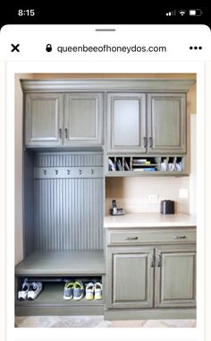 a kitchen with gray cabinets and shoes on the counter top, next to a sink