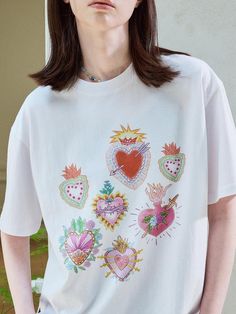 Composition : 100% cottonColor : WHITECountry of Origin : Republic of Korea White Heart-shaped T-shirt For Spring, Summer Cotton T-shirt With Heart Print, White Relaxed Fit Tops With Heart Print, White Heart Print Top With Relaxed Fit, Casual Cotton Shirt With Heart Print, Cotton Tops With Heart Print And Relaxed Fit, Cotton Relaxed Fit Top With Heart Print, Cotton Top With Heart Print And Relaxed Fit, Relaxed Fit Cotton Top With Heart Print