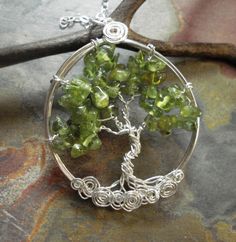 We handmade this unique & gorgeous wire wrapped Tree of Life pendant necklace. The pendant is made with gorgeous semi transparent Peridot gemstone using .925 Sterling Silver wire. Peridot tree is available in Gold filled wire. Here is the listing to view: www.etsy.com/listing/667833628/gold-filled-tree-of-life-necklace?ref=shop_home_active_1 ~~The pendant measures about 1-3/4 inch in diameter. It comes with .925 STERLING SILVER chain. ~~ Each pendant is handmade, so please allow slight varia Silver Wire Necklaces Gift, Silver Wire Necklace Gift, Silver Wire Necklaces As A Gift, Silver Wire-wrapped Necklace, Silver Wire Wrapped Necklace, Wire Pendant Necklace As A Gift, Handmade Spiritual Wire Jewelry, Wire Pendant Necklace For Gift, Unique Wire Jewelry Gift