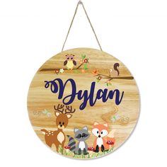 a wooden sign that says dylan with animals on it