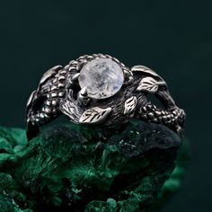 🌟 Warm Greetings, Jewelry Enthusiasts! 🌟 Step into a world where elegance meets personalization with our handcrafted silver rings. Each piece is a testament to unique artistry, blending mystical charm with modern finesse. Our collection offers a special touch for those who adore distinctive and thoughtfully designed jewelry. 🌈 Customization at Your Fingertips: Choose your perfect ring size and select from a variety of enchanting gemstones using our user-friendly dropdown menus. We delight in offering you the chance to create a ring that resonates with your personal style and story. ✨ Design It Your Way: Dreaming of a specific look? We're here to make it happen! Whether it's altering dimensions, adding extra gemstones, or choosing a different material, reach out to us. Your imagination i Handmade Fantasy Wedding Rings, Unique Gemstone Snake Ring For Promise, Mystical Round Crystal Promise Ring, Mystical Handmade Crystal Wedding Ring, Handmade Mystical Crystal Ring For Anniversary, Handmade Mystical Crystal Wedding Ring, Fantasy Handmade Jewelry For Promise Ring, Unique Round Snake Ring Gift, Sterling Silver Fantasy Ring