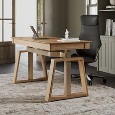 a wooden desk with a laptop on it in an office area next to a bookcase