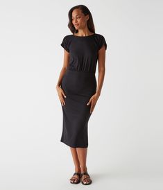 Crafted from our ultra rib fabric, a blend of exquisitely soft cotton and modal, this midi dress is the perfect day-to-night piece. It has a beautiful Sabrina neckline, ruched cap sleeves, and a body-skimming silhouette. The ruched detailing on the skirt helps adjust the dress to your desired fit. This style runs big. We recommend a selecting a smaller size than what you normally wear. Black Non-stretch Midi Dress For Day Out, Non-stretch Black Midi Dress For Day Out, Non-stretch Dark Wash Midi Dress, Black Stretch Knit Midi Dress, Black Knee-length Knit Midi Dress, Sabrina Neckline, Rib Fabric, Ribbed Fabric, Cap Sleeves