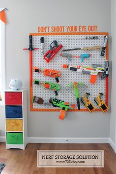 a peg board with lots of tools on it and the words don't shoot your eye out