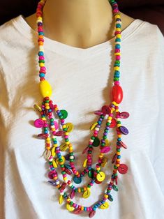 Colorful Statement Necklace Boho Ethnic Handmade Wood Beads. Stylish Necklace that will work with most outfits. This is a must have for to compliment your wardrobe. Lightweight and Easy on and Off. Makes a nice gift or just for yourself! Comes in a Gift Bag. Beach Necklace With Large Multicolor Beads, Wooden Beads Jewelry For Summer Festival, Wooden Beads For Summer Festival, Summer Festival Jewelry With Wooden Beads, Summer Festival Wooden Beads Jewelry, Hippie Multicolor Beach Necklaces, Summer Festival Wooden Beads, Summer Wooden Beaded Necklaces With Round Beads, Summer Wooden Beaded Necklaces