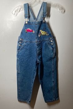 "Purchase patches professionally done just like that years ago / No issues / smoke free home / made in Hong Kong / labeled sz 6 measures waist 13\" / inseam 16 1/2\" / length (shoulder straps fully extended to bottom leg) 36\" / No issues good condition (88)" Vintage Denim Blue Bib Front Overalls, Vintage Dark Wash Bib Front Overalls, Vintage Denim Shortalls With Bib Front, Retro Bib Front Overalls In Medium Wash, Vintage Denim Bib Front Shortalls, Retro Denim Bib Front Jumpsuit, Vintage Bib Front Denim Jumpsuit In Medium Wash, Vintage Denim Blue Bib Front Jeans, Vintage Medium Wash Denim Jumpsuit With Bib Front