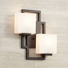 This wall sconce from the Possini Euro Design collection offers a modern, stylish option for wall lighting. Church Lighting, Mountain Kitchen, Bath Lighting, Fitted Bathroom, Indoor Wall Sconces, White Lamp Shade, Modern Wall Sconces, Bedside Lighting, Modern Wall Lights