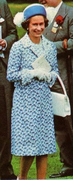 an old photo of queen elizabeth and prince edward with other people in uniform behind her