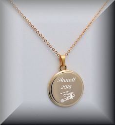 "This engraved gold circle disc necklace makes a great personalized gift. This engraved necklace can be personalized on both sides for that special someone. Add a custom engraving with a name, date, or initials. Dimensions: 0.875\" x 0.875\" Includes 20\" chain Material: Gold Plated How To Send Engraving Instructions: When you are ready to order click ADD TO CART. During checkout fill out the ADD A NOTE section with your engraving instructions. You can also send a message prior to purchase to di Personalized Gold Necklace For Graduation Gift, Personalized Circle Jewelry For Personalized Gift, Personalized Circular Jewelry, Personalized Yellow Gold Charm Necklace In Stainless Steel, Customized Gold Necklace With Round Pendant, Gold Round Charm Necklaces With Engraving Option, Gold Charm Necklaces With Engraving Option, Personalized Medallion Charm Necklaces, Gold Stainless Steel Necklaces With Engraving Option