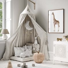 a baby's room with a giraffe tent and toys on the floor