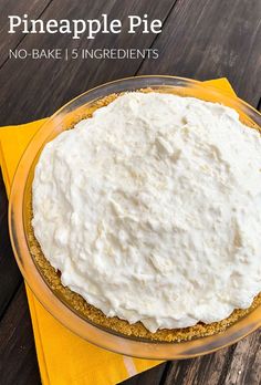 a no bake pineapple pie in a glass pie plate on a yellow napkin