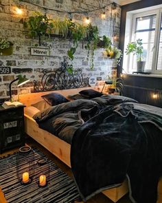 a bedroom with brick walls and plants on the wall