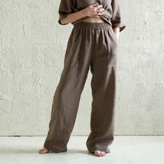 "Loose, relaxed-fit linen pants with large pockets and an elastic waist. Carefully handmade of very soft medium weight, natural linen fabric. * 100% linen * color in the pictures - deep taupe PANTS SIZE ---------------- *S waist - 21.5\"-27.5\" / 55-70cm hips - 31.5\"-35.5\" / 80-90cm height - 61\"-66\" / 155-168cm pants length (from waist to bottom hem) - 39.5\" / 100cm ---------------- *M waist - 23.5\"-31.5\" / 60-80cm hips - 35.5\"-39.5\" / 90-100cm height - 64.5\"-70\" / 164-178cm pants len Wide Leg Linen Harem Pants, Solid Color Linen Wide Leg Harem Pants, Solid Linen Wide Leg Pants With Relaxed Fit, Relaxed Fit Linen Harem Pants With Pockets, Baggy Linen Wide Leg Pants For Loungewear, Baggy Linen Wide Leg Lounge Pants, Relaxed Flax Bottoms With Pockets, Solid Linen Harem Trousers, Solid Linen Pants With Elastic Waistband