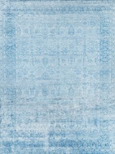 a blue rug with an intricate design on the top and bottom, is shown in full view