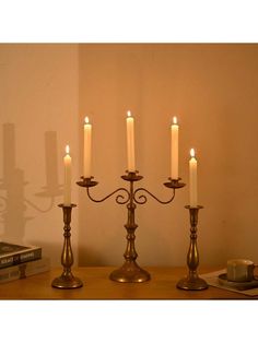 a group of candles sitting on top of a wooden table