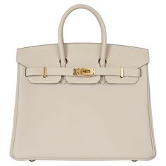 100% authentic Hermès Birkin 25 bag in Craie (cream) Veau Togo leather with gold-plated hardware. Lined in Chèvre (goat skin) with an open pocket against the front and a zipper pocket against the back. Has been carried once and is in virtually new condition. Protective stickers are intact except on tiret and back plate. Comes with key,lock, clochette, dust bag and receipt. Measurements Model H041344CC 10 Height 20cm (7.8in) Width 25cm (9.8in) Depth 13cm (5.1in) Drop of the Handle 5.5cm (2.1in) H French Tote Bag, Embroidered Shoulder Bag, Expensive Bag, Cream Bags, Hermes Birkin 25, Togo Leather, Kelly Bag, Luxury Purses, Birkin 25