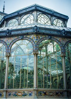 the inside of a building with many windows and ornate designs on it's sides