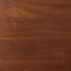 a close up view of a wooden surface with some grainy woodgrains on it