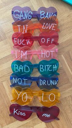 sunglasses with words written on them sitting on the floor