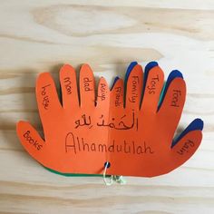 an orange and blue hand with writing on it that says, i am madduulah