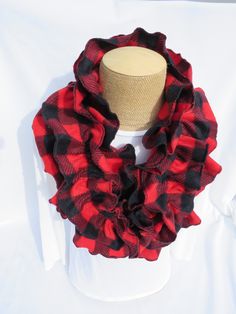 This buffalo check fleece ruffle infinity scarf will be a cozy addition to your accessories.   The red and black lumberjack ladies fleece scarf makes a unique gift for that special lady on your list.   This circle scarf is 56 inches long.  The elastic in the scarf gathers it up to an approximately 36 inch circle.  The scarf has two layers.  The bottom layer is approximately 8.5 inches wide.   The scarf may be hung around your neck and the fluffy ruffles drape down.  You may also wrap it twice ar Canadian Maple Leaf, Fleece Scarf, Tartan Scarf, Tartan Fabric, Circle Scarf, Blanket Scarf, Lumberjack, Buffalo Check, Look Plus