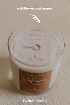 a candle with the words wildflower seed paper on it