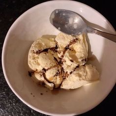 a bowl filled with ice cream on top of a table