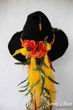 Modern wool knit witch hat beautifully decorated with florals, ribbons, beads and pendants. One-of-a-kind design that's perfect for a costume, Renaissance Faire, cosplay or your own flair! One size fits most, comfortable, breathable, soft, stretchable knit blend. Brim can be shaped as desired. Head 57cm = 22.44" Brim 5cm = 1.97" (may be small differences) All of my hats are unique and one of a kind. I really enjoy making them and creating a wearable piece of art! Handmade Bohemian Costume Hats For Festivals, Bohemian Headpieces For Halloween Costume Party, Handmade Adjustable Costume Hats For Halloween, Black Bohemian Costume Accessories For Festival, Bohemian Festival Hats And Headpieces For Carnival, Handmade Adjustable Halloween Costume Hats And Headpieces, Adjustable Handmade Halloween Costume Hats And Headpieces, Whimsical Handmade Costume Hats And Headpieces For Festivals, Bohemian Costume Hats And Headpieces For Carnival