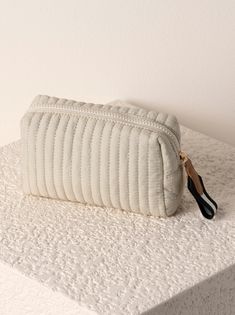 Perfect your on-the-go lifestyle with Shiraleah's Ezra Small Boxy Cosmetic Pouch. This pouch features a quilted nylon body and a boxy silhouette, perfectly matching the material throughout Shiraleah's Ezra collection. Measuring L 7" × W 3" × H 4" and equipped with an inner zip and slip pocket, this pouch is perfect for storing your makeup, toiletries or any odds and ends that you may need during travel or on a daily basis. Pair with other items from Shiraleah to complete your look! Color: Ivory Lake Gifts, Greek Gifts, Cosmetic Items, Small Pouches, Shoe Gifts, How To Make Handbags, Future Plans, Colour Palettes, Cosmetic Pouch