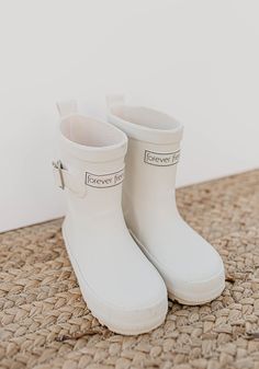 Introducing the forever french rain boot! This was quite the project to add rain boots to our line as the manufacturing process is so completely different than sewn items! We selected the classic British design mold for our boots made of all natural rubber. This boot is soft and durable and will wear well in wet and dry climates. Our boots have a high quality breathable lining for comfort and a non slip rubber sole. These boots were made in the perfect gender neutral white that can be worn with White Baby Boots, High Rain Boots, White Rain Boots, Best Baby Shoes, Playing In The Rain, Cute Rain Boots, Boots Cream, Girls Rain Boots, Toddler Rain Boots