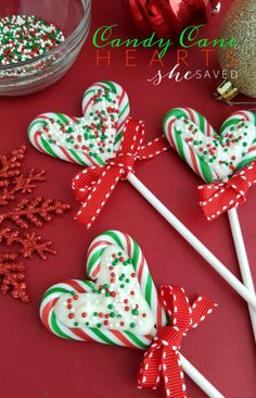 candy canes are arranged on a red table