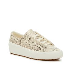 Keds-Remi Slip-On Sneaker - Women's Update your casual wardrobe with the Remi slip-on sneaker from Keds. This leather pair is crafted with a soft fabric lining and a foam footbed for maximum comfort. Complete with a lace-free design to add a laidback touch to every look. Spring Beige Slip-on Sneakers With Rubber Sole, Casual Wedge Sneakers With Cushioned Footbed For Spring, Casual Spring Wedge Sneakers With Cushioned Footbed, Casual Wedge Sneakers With Rubber Sole For Spring, Comfortable Spring Platform Sneakers With Flat Heel, Casual Lace-up Slip-ons With White Sole, Spring Platform Sneakers With Cushioned Footbed, Spring Platform Sneakers With Cushioned Footbed And Flat Heel, Spring Lace-up Platform Sneakers With Speckled Midsole