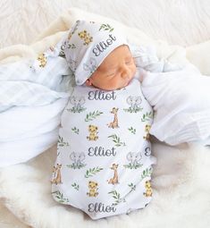 a baby sleeping on top of a white blanket