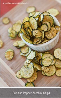 a white bowl filled with sliced zucchini chips