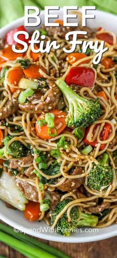 beef and vegetable stir fry in a white bowl