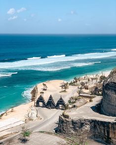 an aerial view of the beach and ocean from atop a hill in bali, indonesia