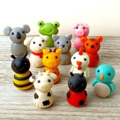 small toy animals are lined up on a table