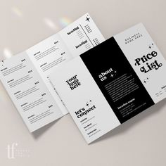 an open brochure with black and white designs on the front, back and sides