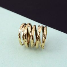 "Coil ring, wrap ring, everyday ring, swirl ring, spiral ring, Silver ring, splint ring, knuckle ring, gift for her, gift for mom, men's ring. ❥ Benefits of Brass Metal : Brass has metaphysical healing properties to boost the immune system and to give courage. It's known to help reduce inflammation and also improve digestion. Brass has the properties of purifying negative energy.  The golden shine symbolizes the sun. It will be useful when you want to clear out shadiness in your mind. ❥ Our products are made of good/high-quality Brass metal and are carefully crafted by hand in our family workshop. The brass metal will develop a nice antique color over time. So, I suggest cleaning it once in a while for getting back to the shiny original color. You can use natural ingredients like lemon or Modern Twist Spiral Stackable Rings As Gift, Gold Spiral Stackable Rings, Adjustable Spiral Stackable Rings, Gift Spiral Ring With A Modern Twist, Handmade Open Ring With A Modern Twist, Modern Twist Toe Ring As Gift, Handmade Open Ring With Modern Twist, Modern Twist Toe Ring For Gift, Handmade Spiral Rings For Gifts