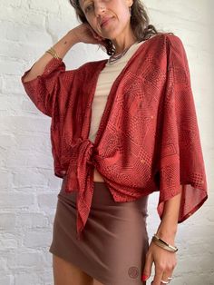 This is free size wrap tie waist blouse made in vintage silk  With wide kimono sleeves, very light, prefect for hot summer days over coat  Super stylish and comfy  MEASURE Free size MATERIAL *silk More trendy boho ideas at  https://www.etsy.com/shop/AltheaStores? Thank You for looking Chic Flowy Kimono For Beach Cover-up, Summer V-neck Shrug, Chic Kimono With Tie Waist And Kimono Sleeves, Summer Open Front Shrug, Chic V-neck Summer Shrug, Chic Flowy Long Sleeve Kimono, Chic Long Sleeve Flowy Kimono, Chic V-neck Shrug For Summer, Beach Cover-up Kimono With Tie Waist