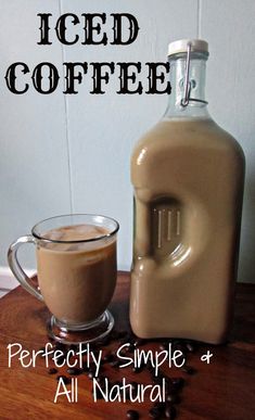 iced coffee in a glass mug next to a jug of liquid