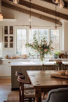 a kitchen filled with lots of wooden furniture