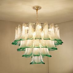 a glass chandelier hanging from the ceiling