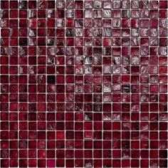 a red glass tile wall that looks like it has been made out of small squares