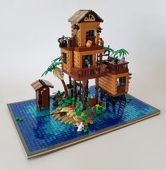 a lego model of a house on the beach