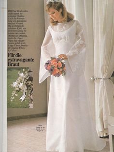 a woman in a white wedding dress holding a bouquet