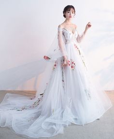 White A-line Tulle Gown, White Ball Gown Evening Dress For Spring, Spring White Gown For Banquet, White Spring Banquet Gown, Spring White Banquet Gown, White Tulle Dress For Banquet, White Floor-length Banquet Dress, White Long Sleeve Tulle Gown, White V-neck Dress For Banquet