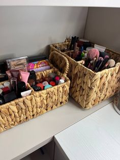 two baskets filled with makeup and other items